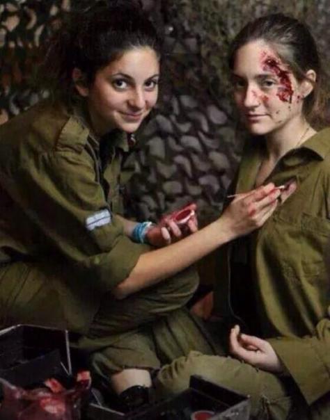 Jewish military girls using fake blood for fake injuries for the TV news