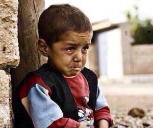 Gaza - tiny little boy trying to be brave by himself